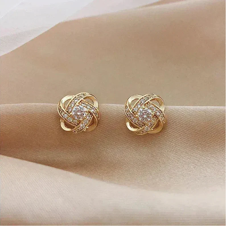 Gouden spiralen oorbellen met kristallen