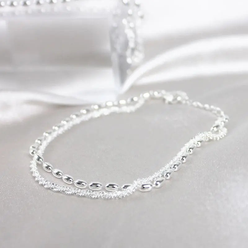 Elegant silver bracelet set with zirconia stones