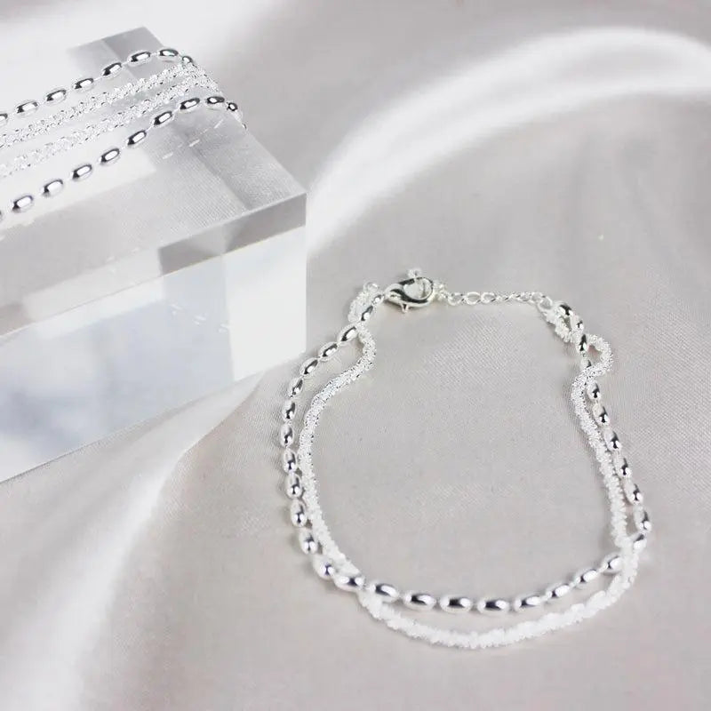 Elegant silver bracelet set with zirconia stones