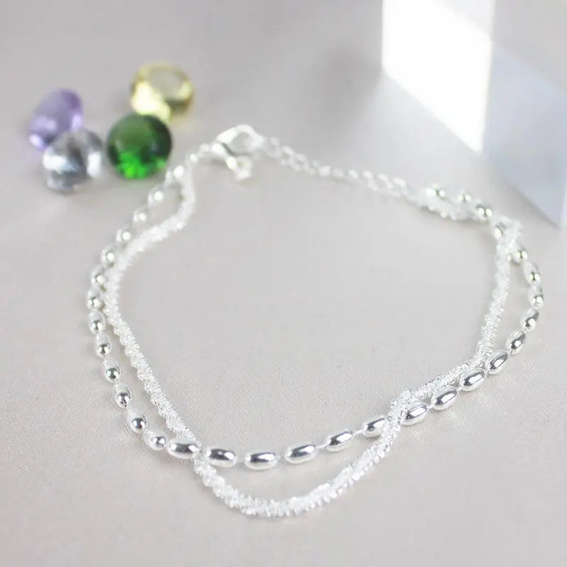 Elegant silver bracelet set with zirconia stones