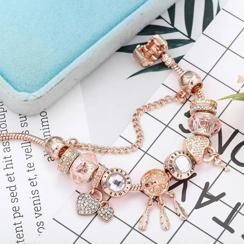 Roze Dromenvanger Armband met Inclusief Zilveren Charms