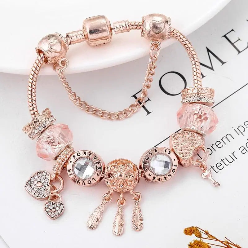 Roze Dromenvanger Armband met Inclusief Zilveren Charms