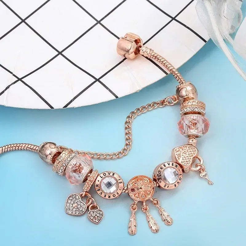 Roze Dromenvanger Armband met Inclusief Zilveren Charms