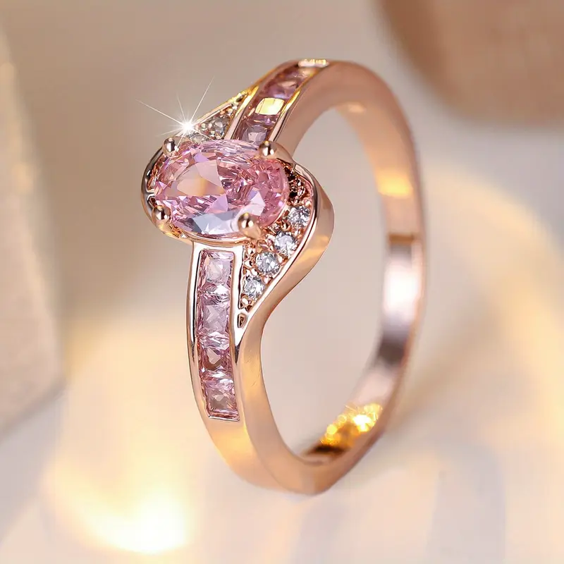 Gold ring with pink crystal