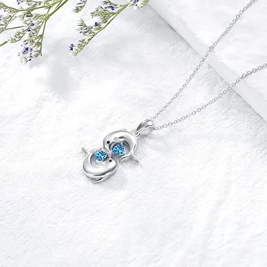 Zilveren Collier met Dubbele Dolfijnen en Blauwe Kristal