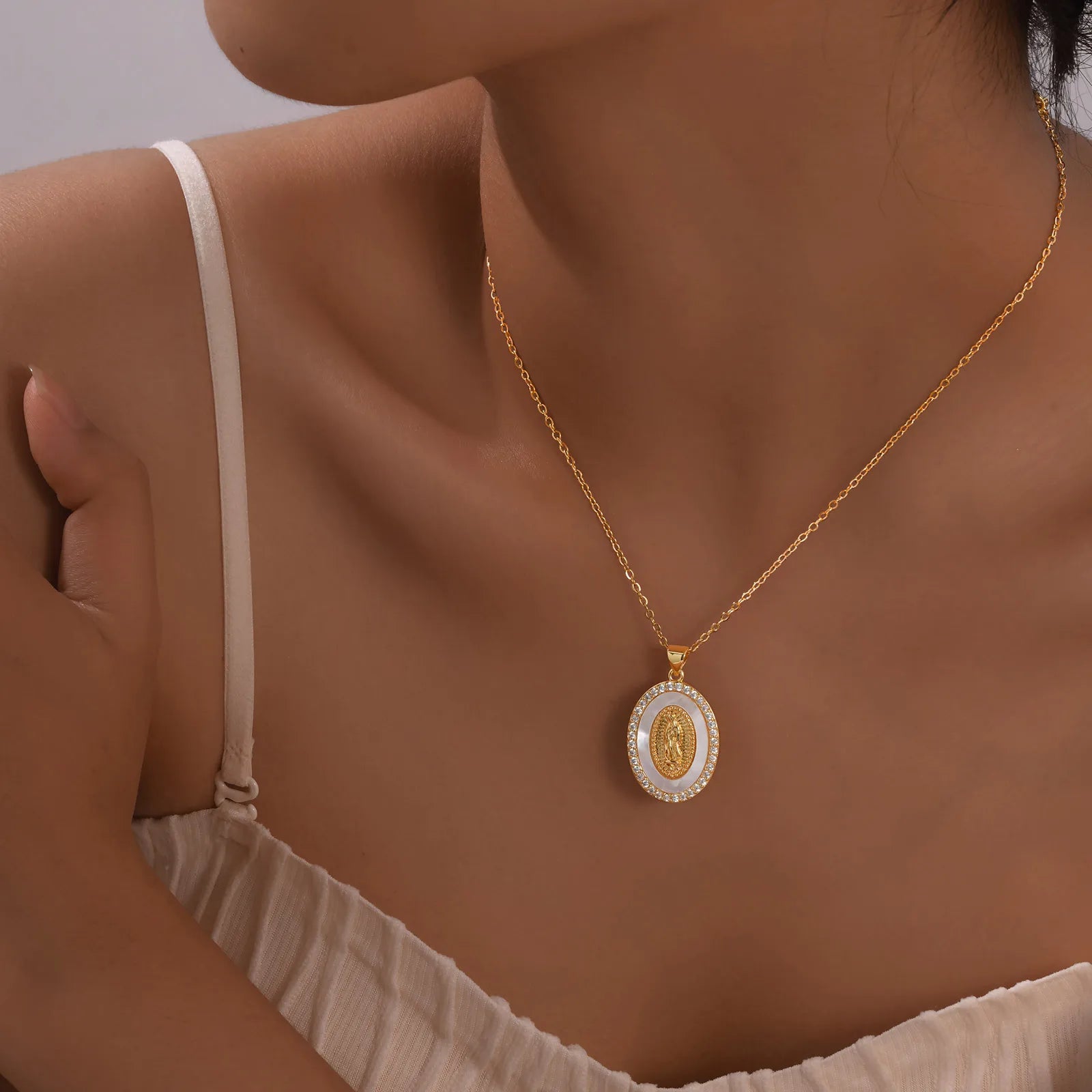 Necklace with Oval Virgin Mary Pendant in Gold